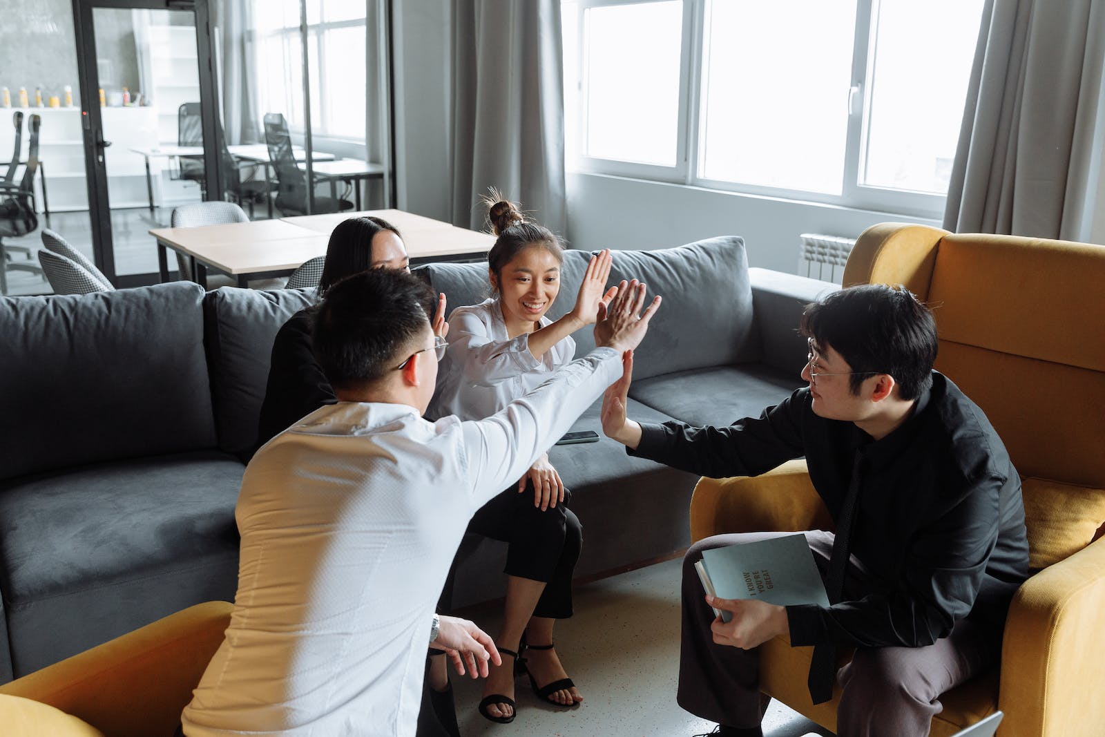 A Group Of People Having A Meeting In The Office